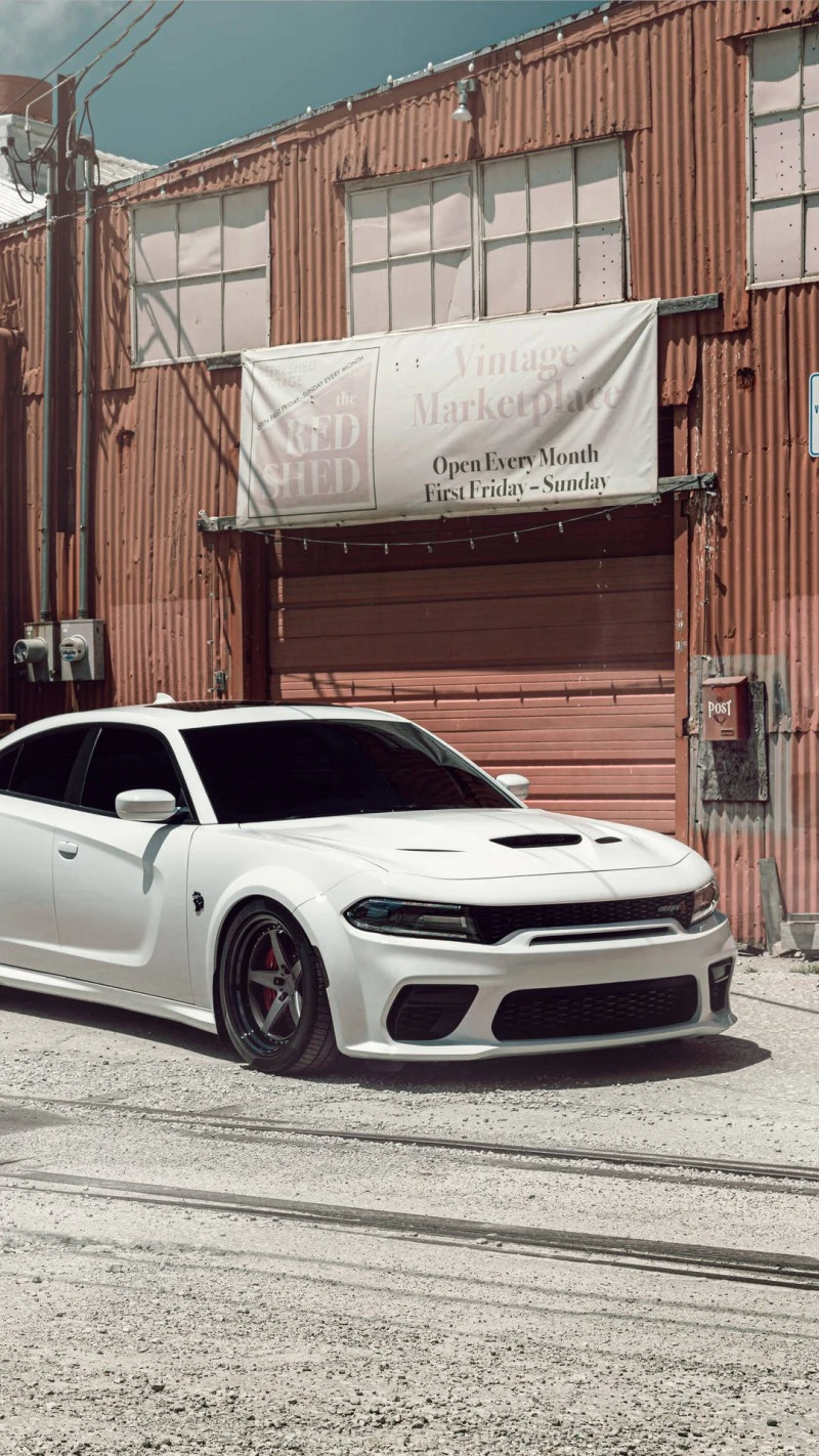 White Dodge Charger in Urban Setting 4K Mobile Wallpaper